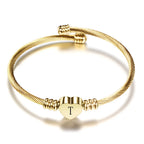 Pulsera corazón con inicial de oro t