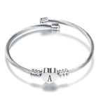 Pulsera corazón con inicial de plata a