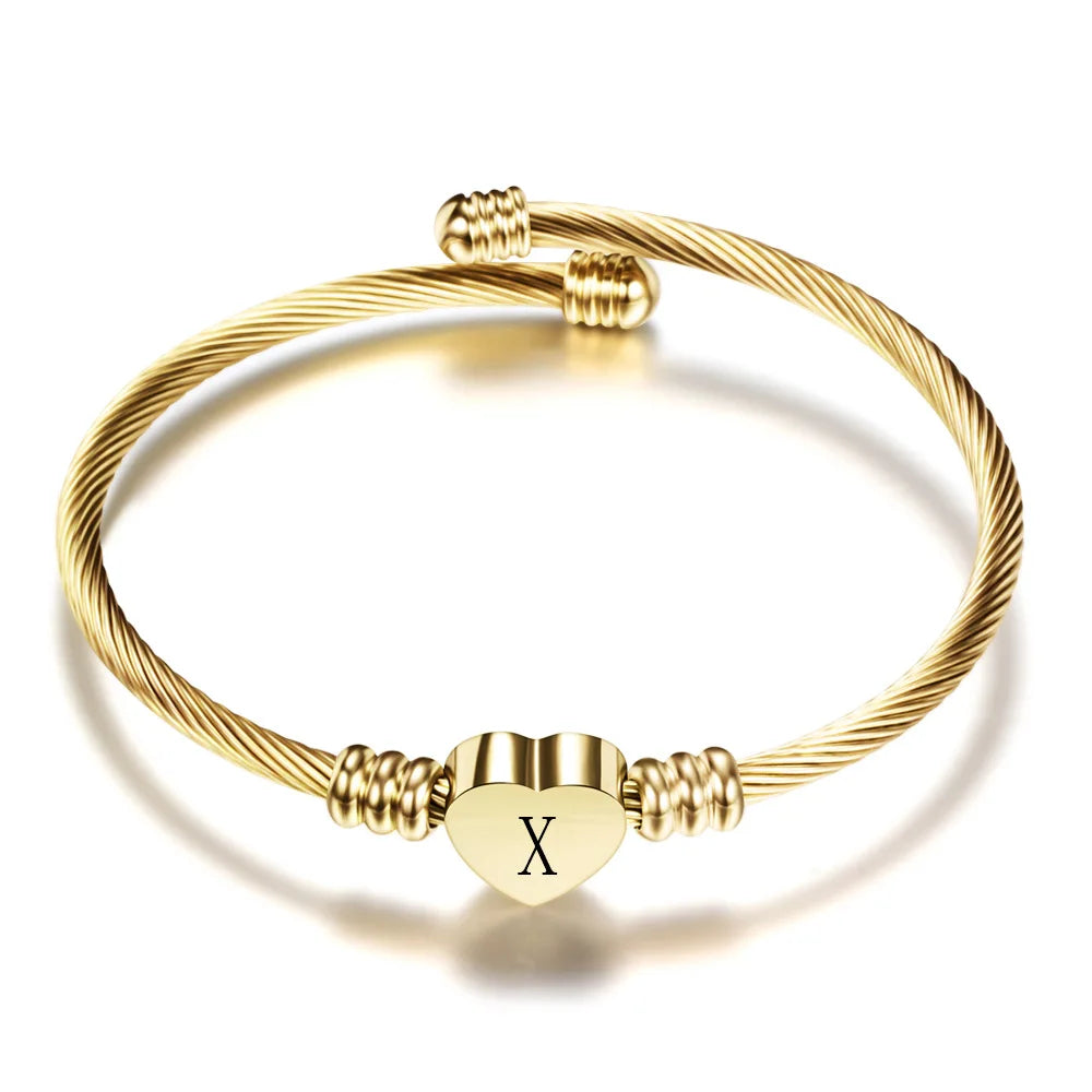 Pulsera corazón con inicial de oro x