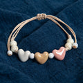Pulsera corazón de cerámica beige