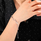 Pulsera corazón y alas de ángel plateado