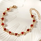 Pulsera de corazones esmaltados dorado y rojo