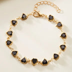 Pulsera de corazones esmaltados dorado y negro