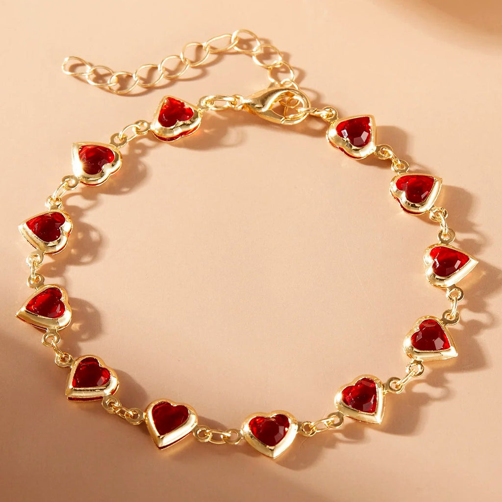 Pulsera de corazones esmaltados dorado y rojo