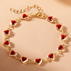 Pulsera de corazones esmaltados dorado y rojo