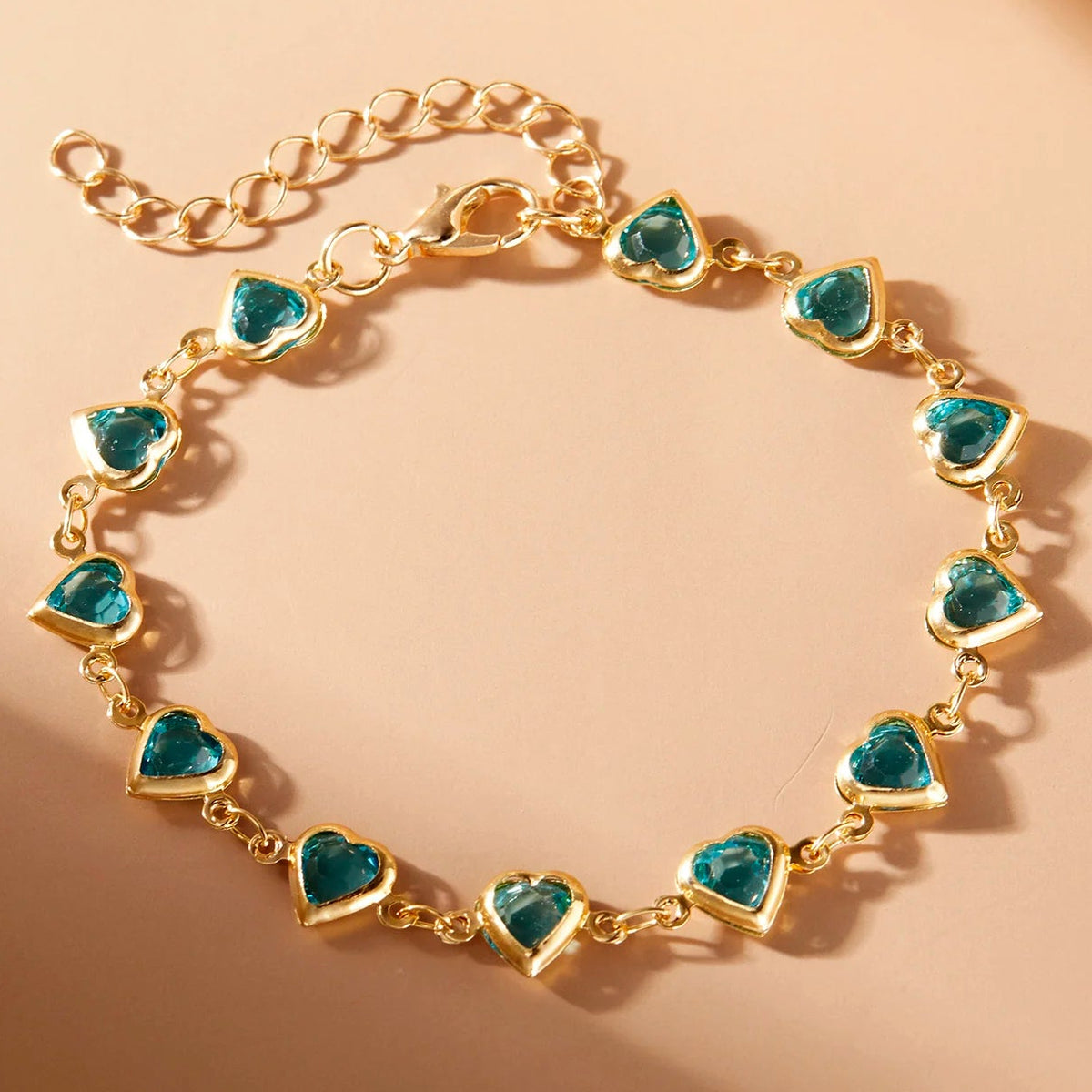 Pulsera de corazones esmaltados dorado y verde