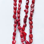 Pulsera de coral rojo en guijarros