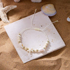 Pulsera de cordón con concha y estrella de mar blanca estrella