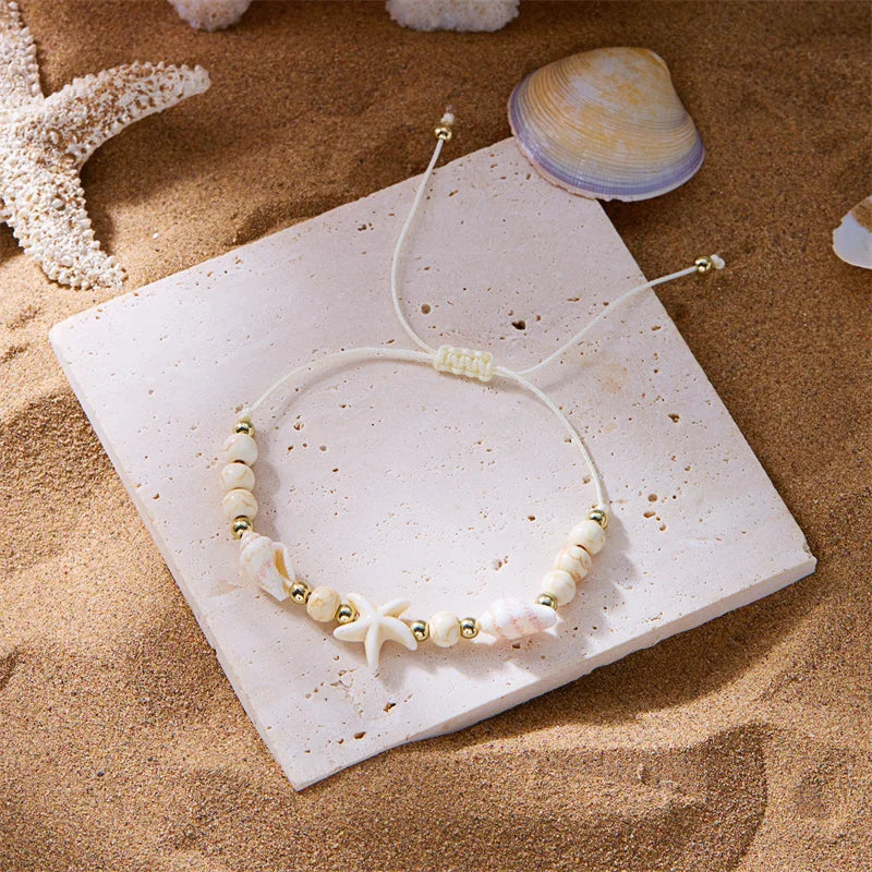Pulsera de cordón con concha y estrella de mar blanca estrella