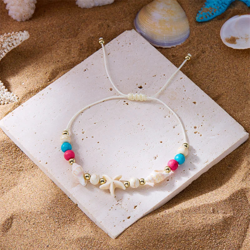 Pulsera de cordón con concha y estrella de mar blanca estrella