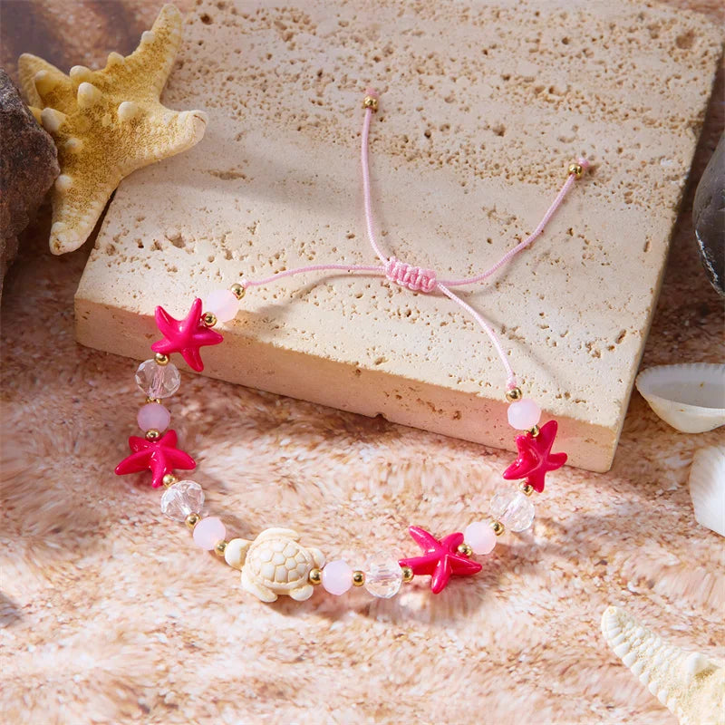 Pulsera de cordón con concha y estrella de mar roja tortuga