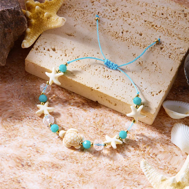 Pulsera de cordón con concha y estrella de mar azul tortuga