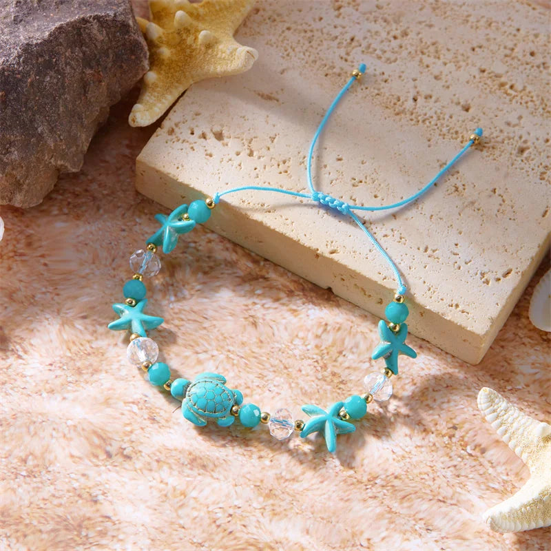 Pulsera de cordón con concha y estrella de mar azul tortuga