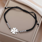 Pulsera de la amistad trébol de cuatro hojas negra y plateada