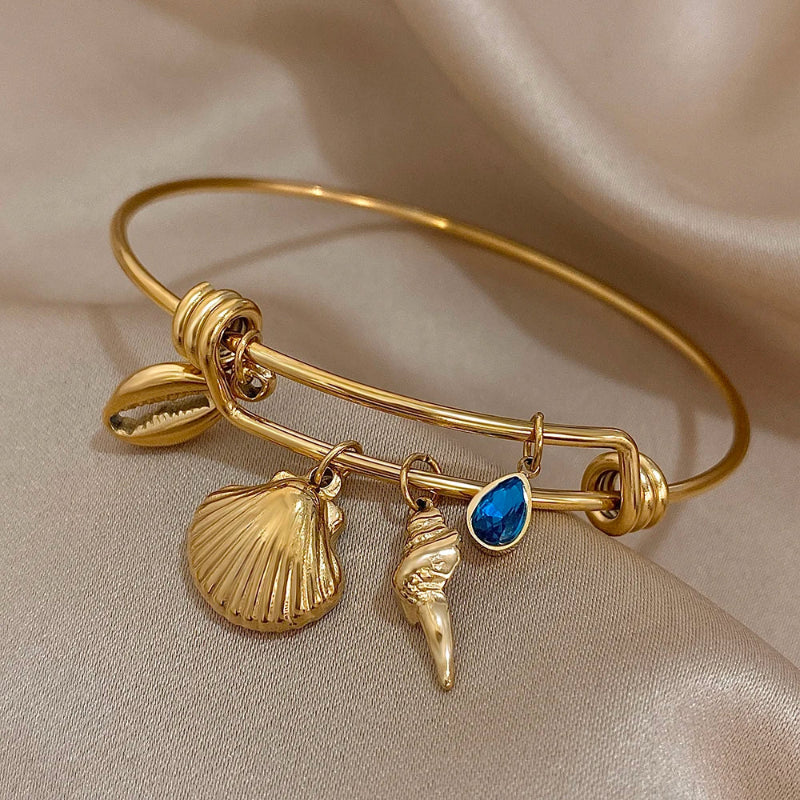 Pulsera de encanto con conchas dorada