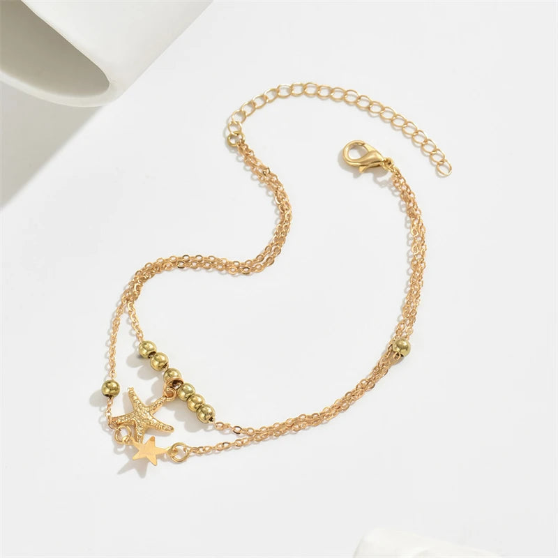 Pulsera de tobillo estrella de mar dorada para mujer