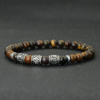 Buddhist protection bracelet in tiger's eye beads with engraved mantras