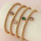 Pulsera dorada con piedra de nacimiento para mujer