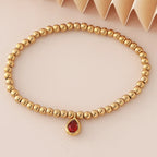 Pulsera dorada con piedra de nacimiento para mujer