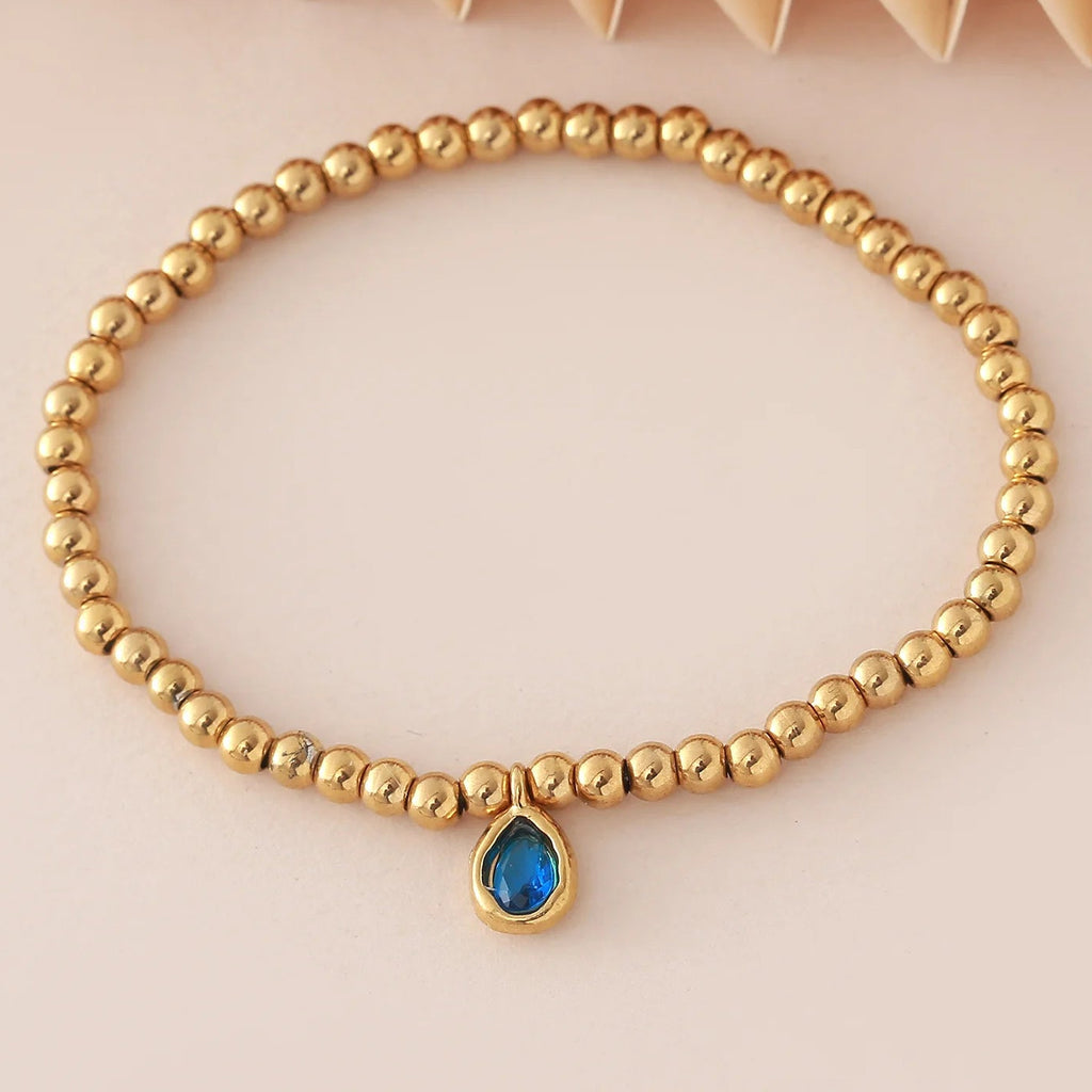 Pulsera dorada con piedra de nacimiento para mujer