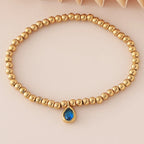 Pulsera dorada con piedra de nacimiento para mujer