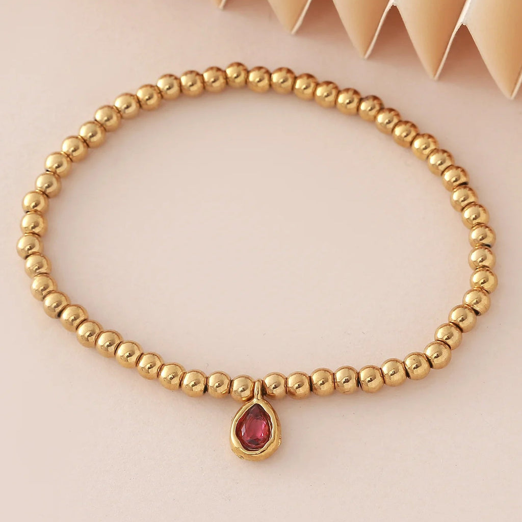 Pulsera dorada con piedra de nacimiento para mujer