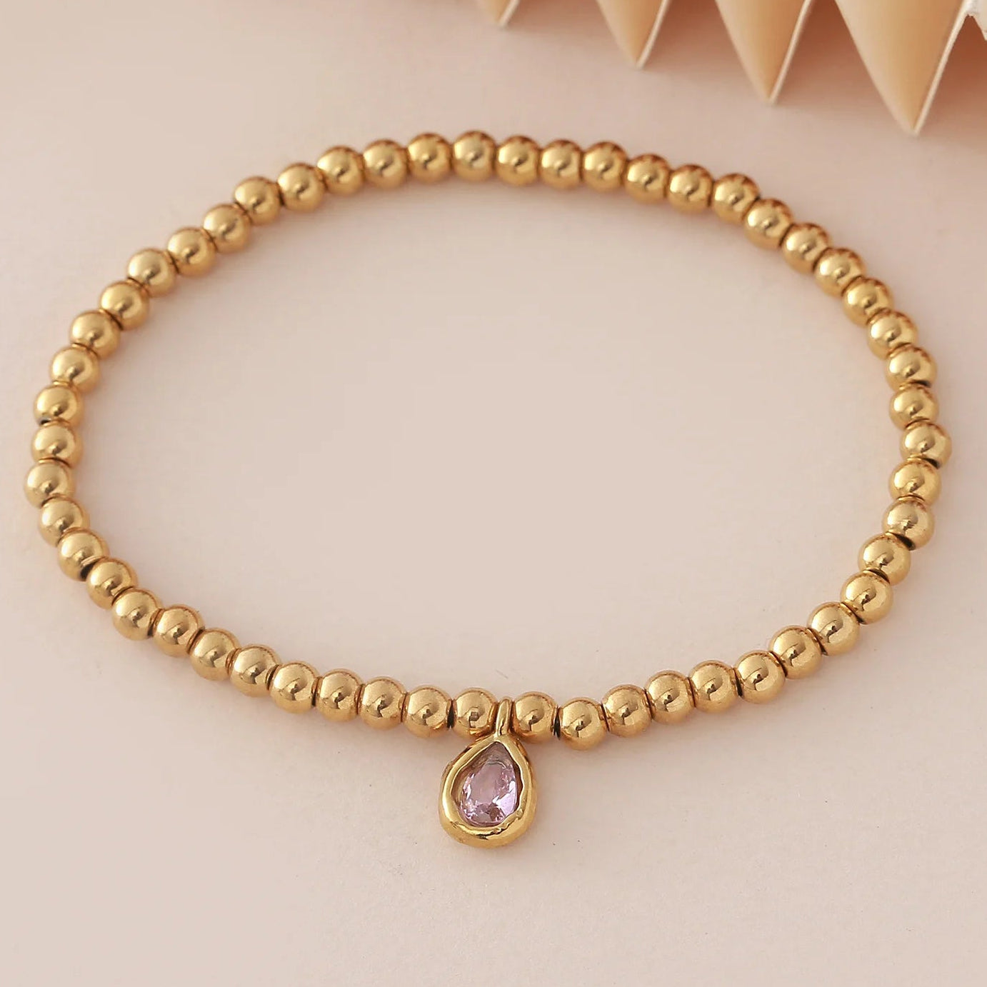 Pulsera dorada con piedra de nacimiento para mujer