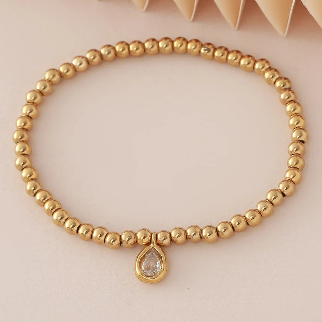 Pulsera dorada con piedra de nacimiento para mujer