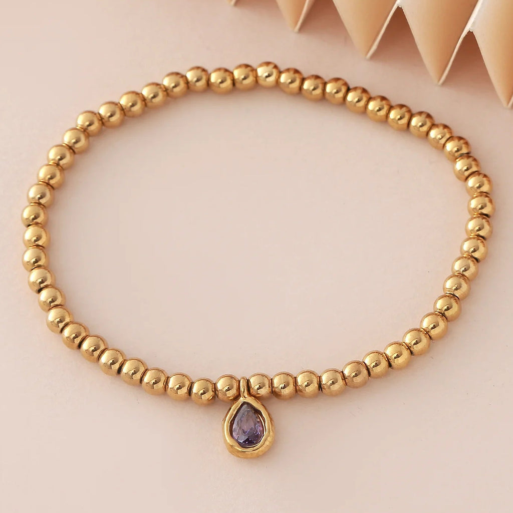 Pulsera dorada con piedra de nacimiento para mujer
