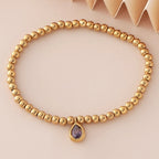 Pulsera dorada con piedra de nacimiento para mujer