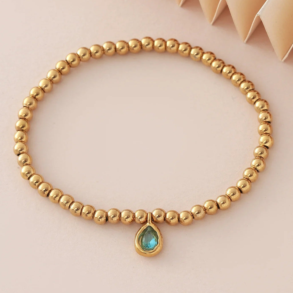 Pulsera dorada con piedra de nacimiento para mujer