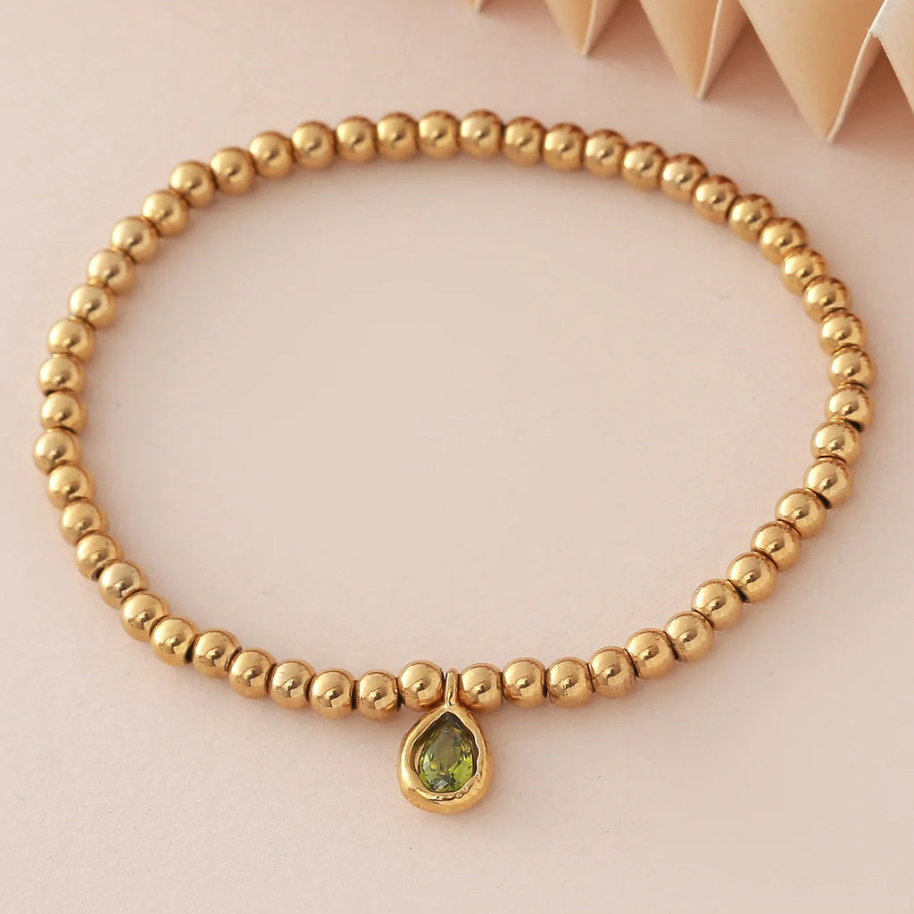 Pulsera dorada con piedra de nacimiento para mujer