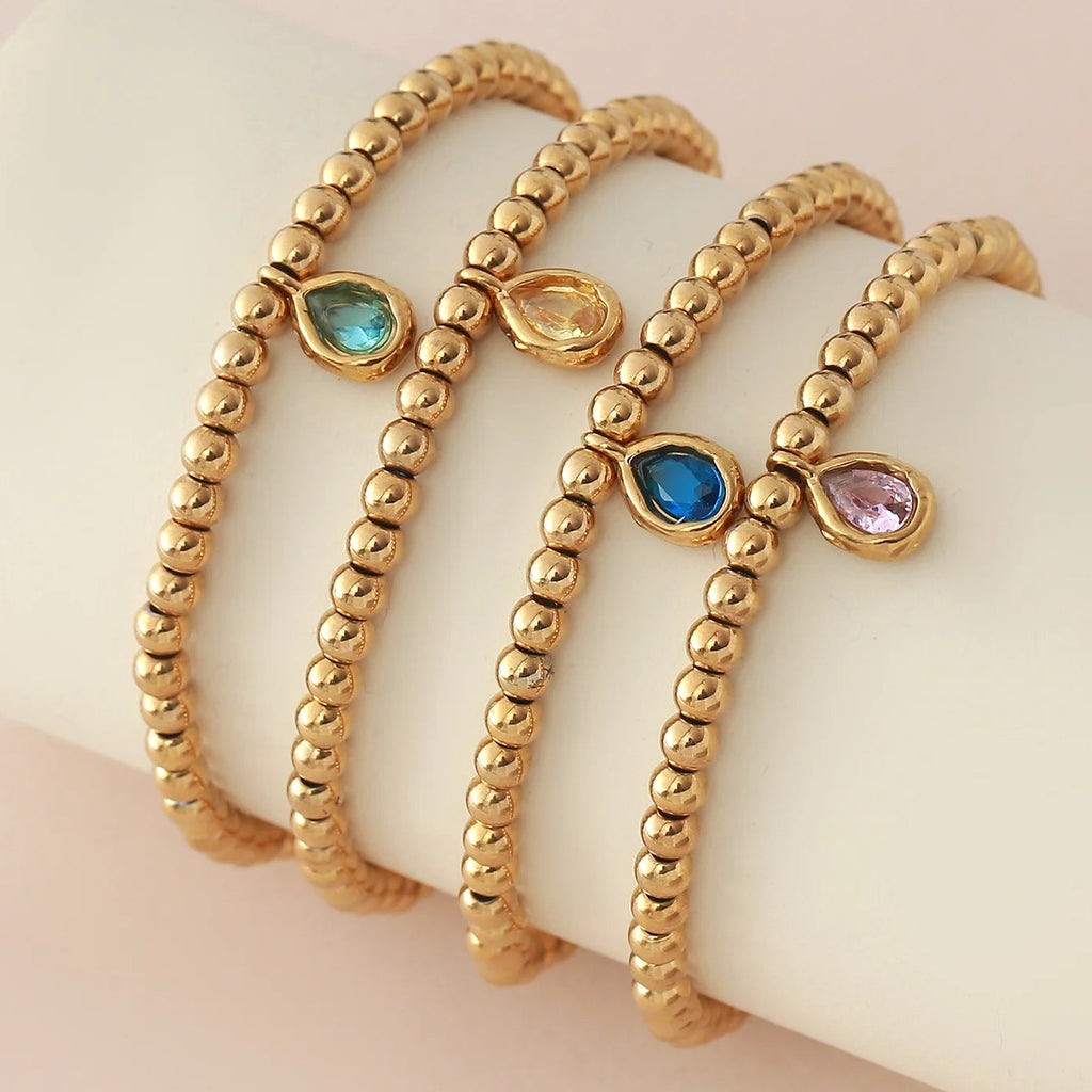 Pulsera dorada con piedra de nacimiento para mujer