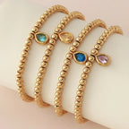 Pulsera dorada con piedra de nacimiento para mujer