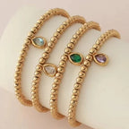 Pulsera dorada con piedra de nacimiento para mujer