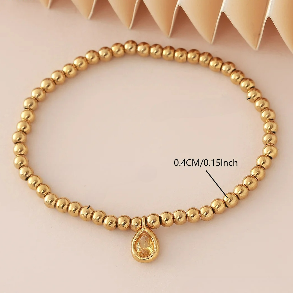 Pulsera dorada con piedra de nacimiento para mujer