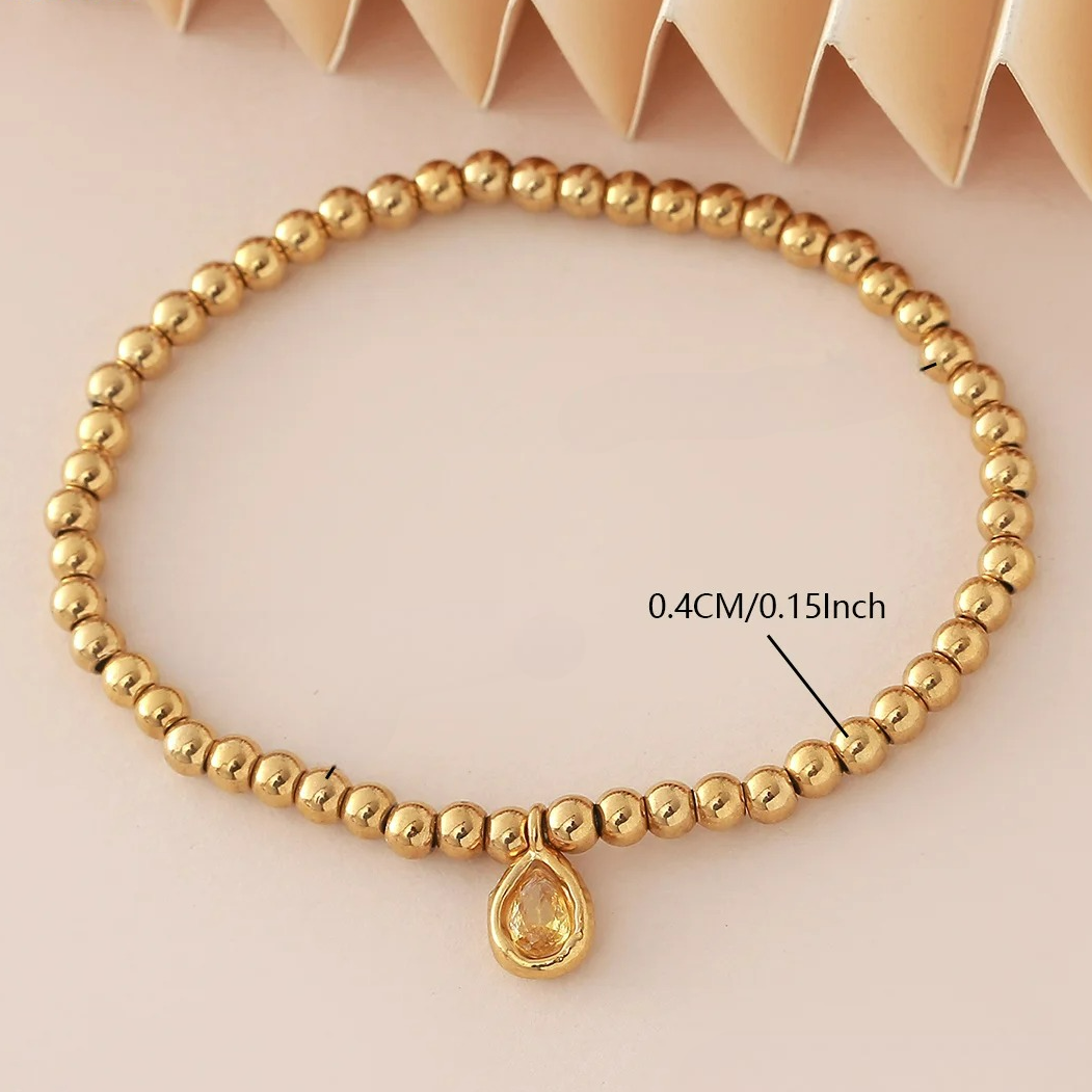 Pulsera dorada con piedra de nacimiento para mujer