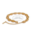 Pulsera dorada con concha cauri