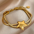 Pulsera de doble vuelta y estrella abombada de oro