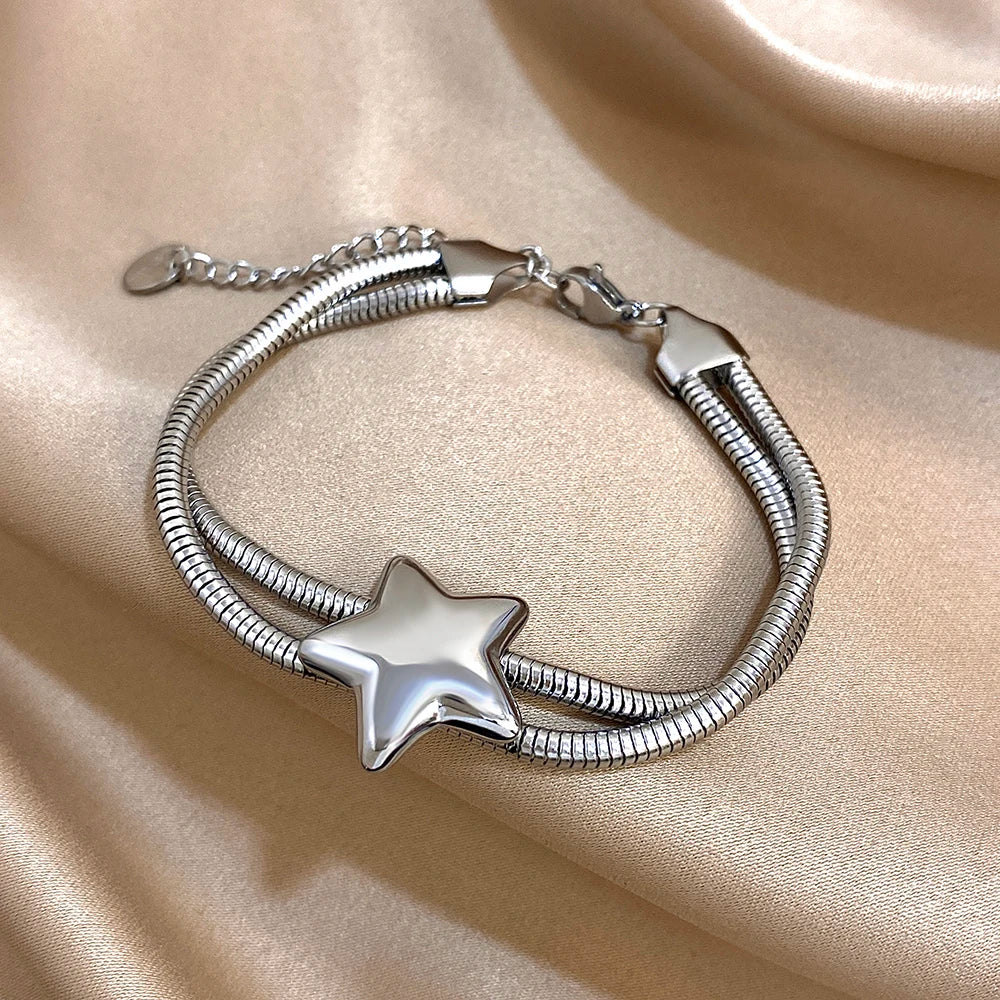 Pulsera de doble vuelta y estrella abombada de plata