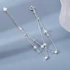 Double-row bracelet with stars and sandblasted beads