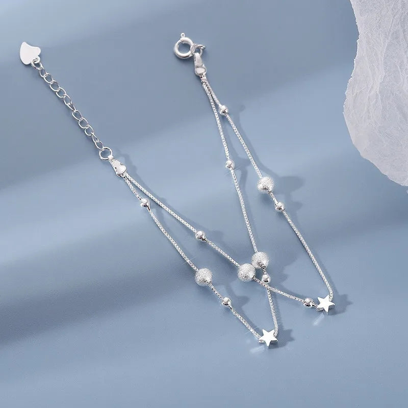 Double-row bracelet with stars and sandblasted beads