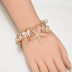 Pulsera Elegante con Conchas dorada
