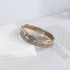 Pulsera de cuero con concha y estrella de mar en oro blanco