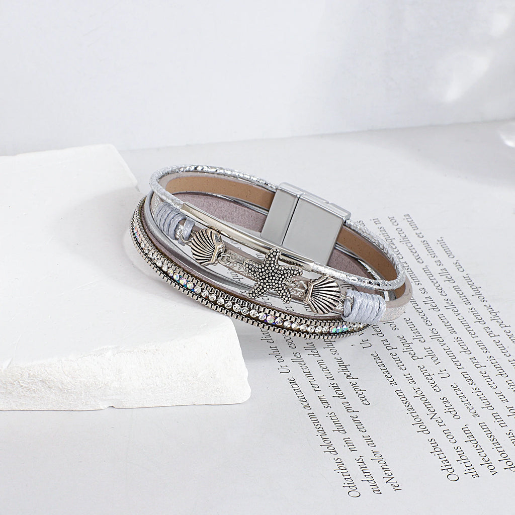 Pulsera de cuero con concha y estrella de mar plata