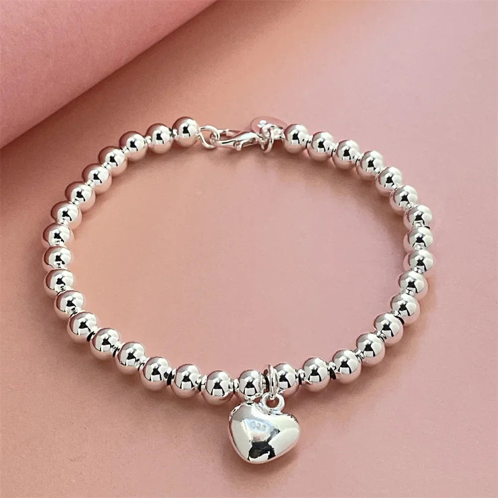 Pulsera de Perlas con CorazónPulsera de Perlas con Corazón