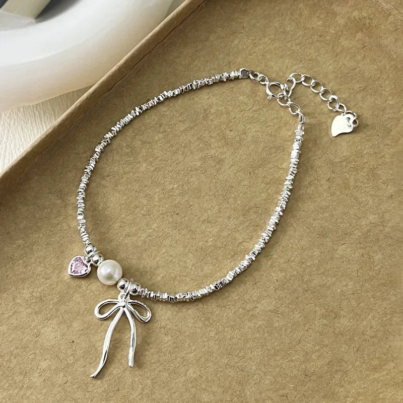 Pulsera Gourmette Nudo de Mariposa y Perla