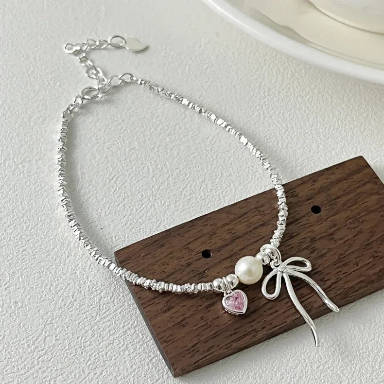 Pulsera Gourmette Nudo de Mariposa y Perla