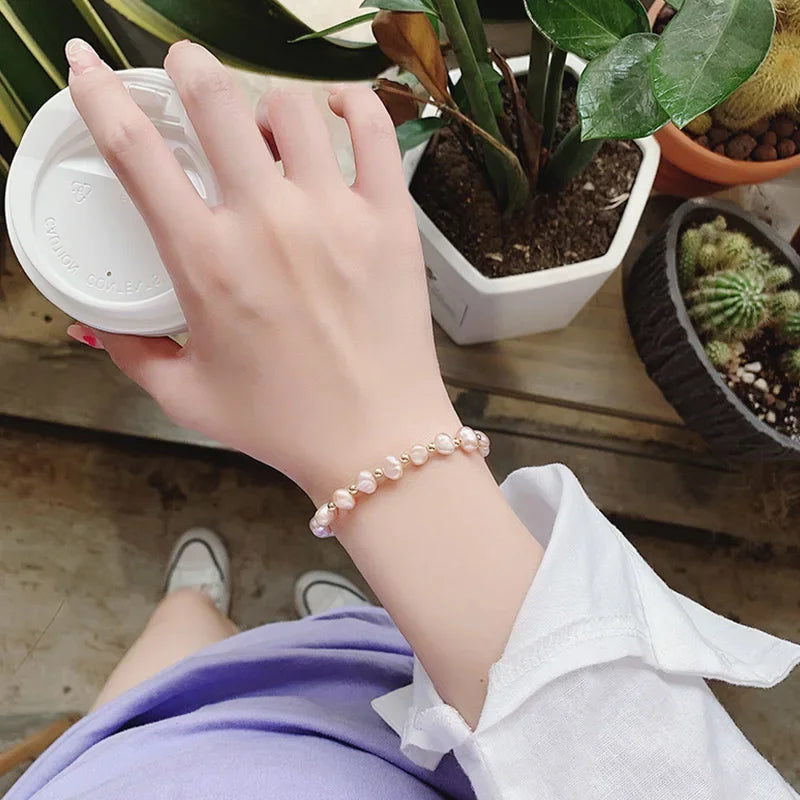 Pulsera de identificación con perlas rosas