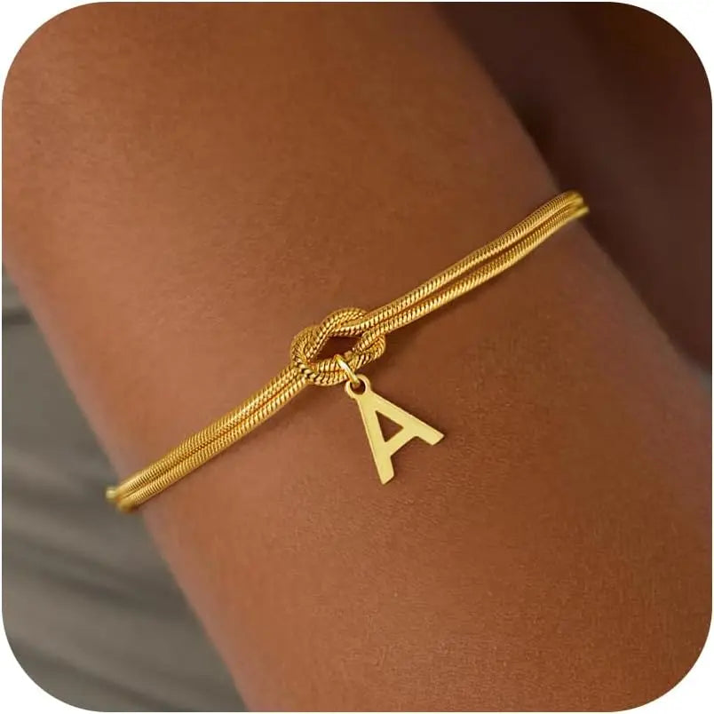 Pulsera con inicial y lazo a